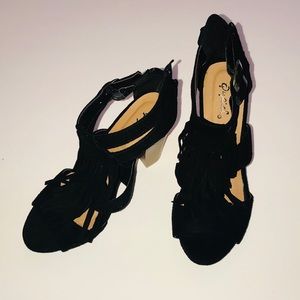 Quips heels with ruffles going down middle